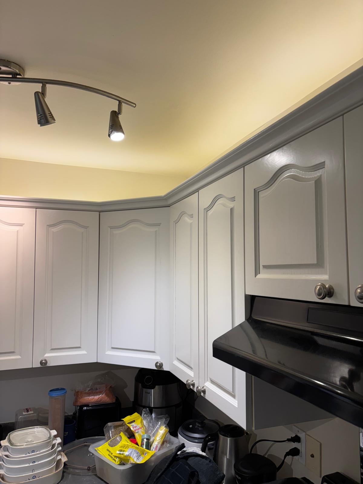 Professionally painted and refinished white kitchen cabinets in Victoria BC home